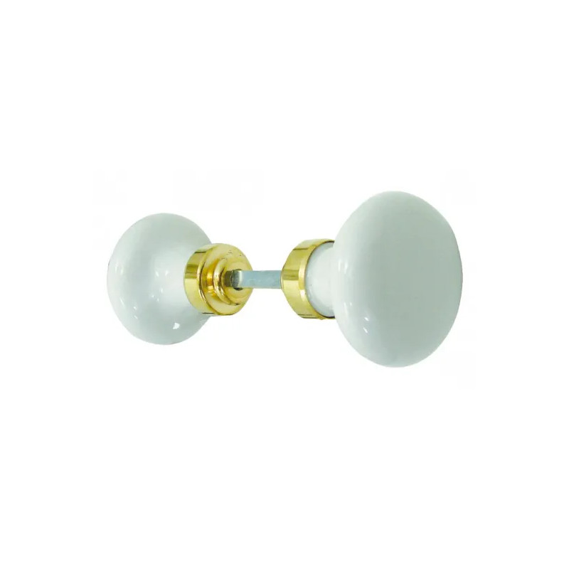 Round double knob in white porcelain and polished brass.