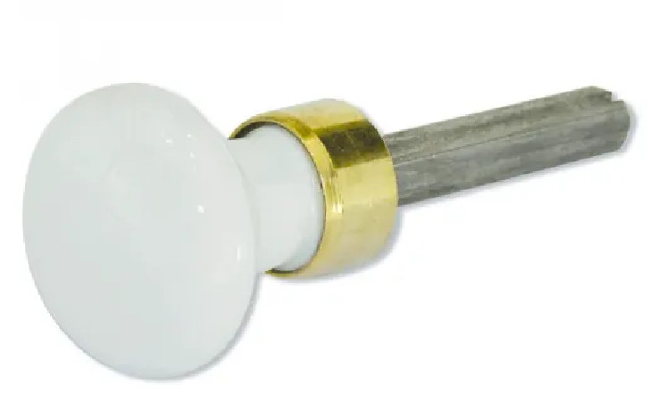 Round knob in white porcelain and polished brass, condemnation.